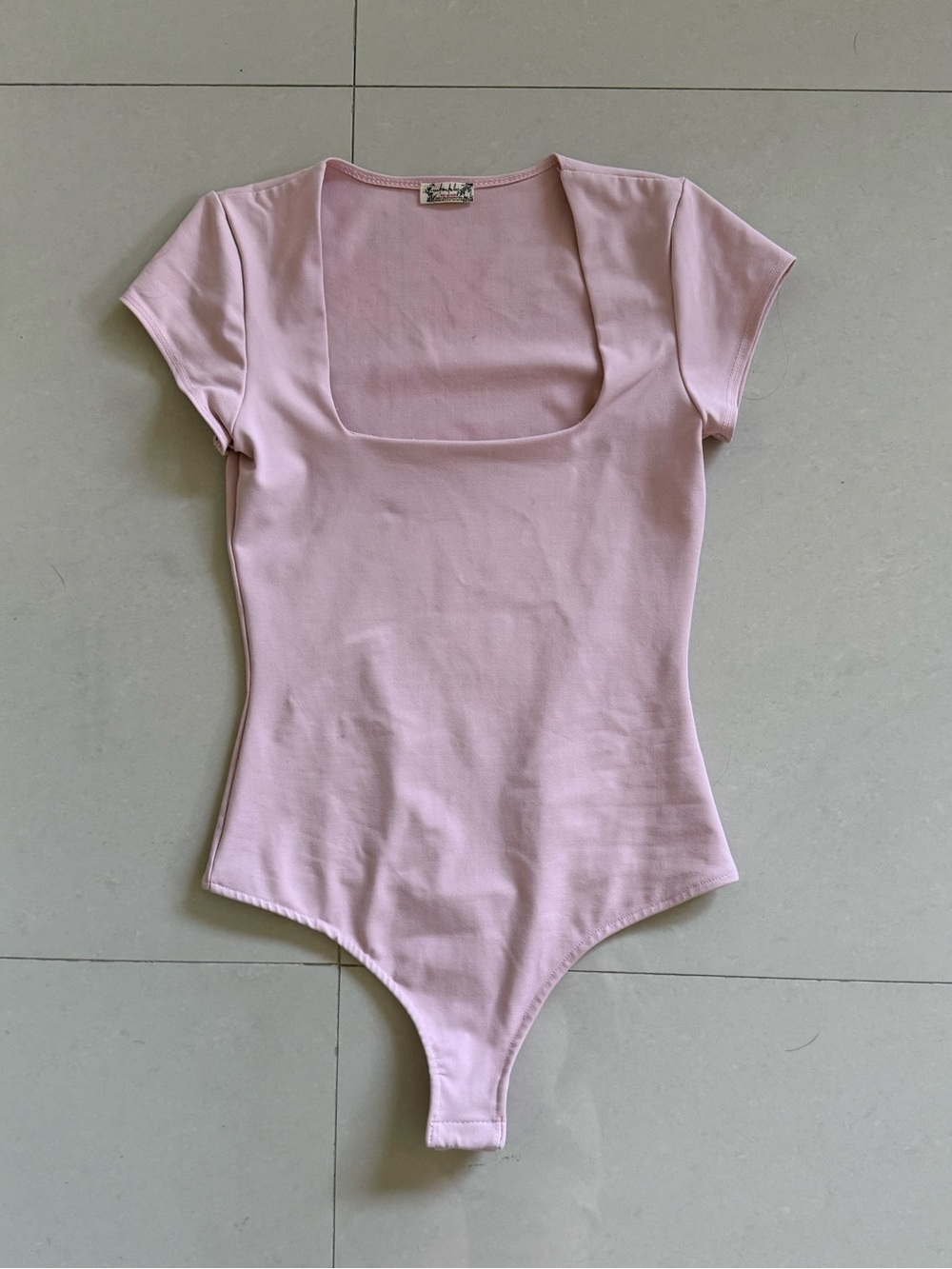 Free People Women’s Scoop Neck Short Sleeve Bodysuit in Light Pink